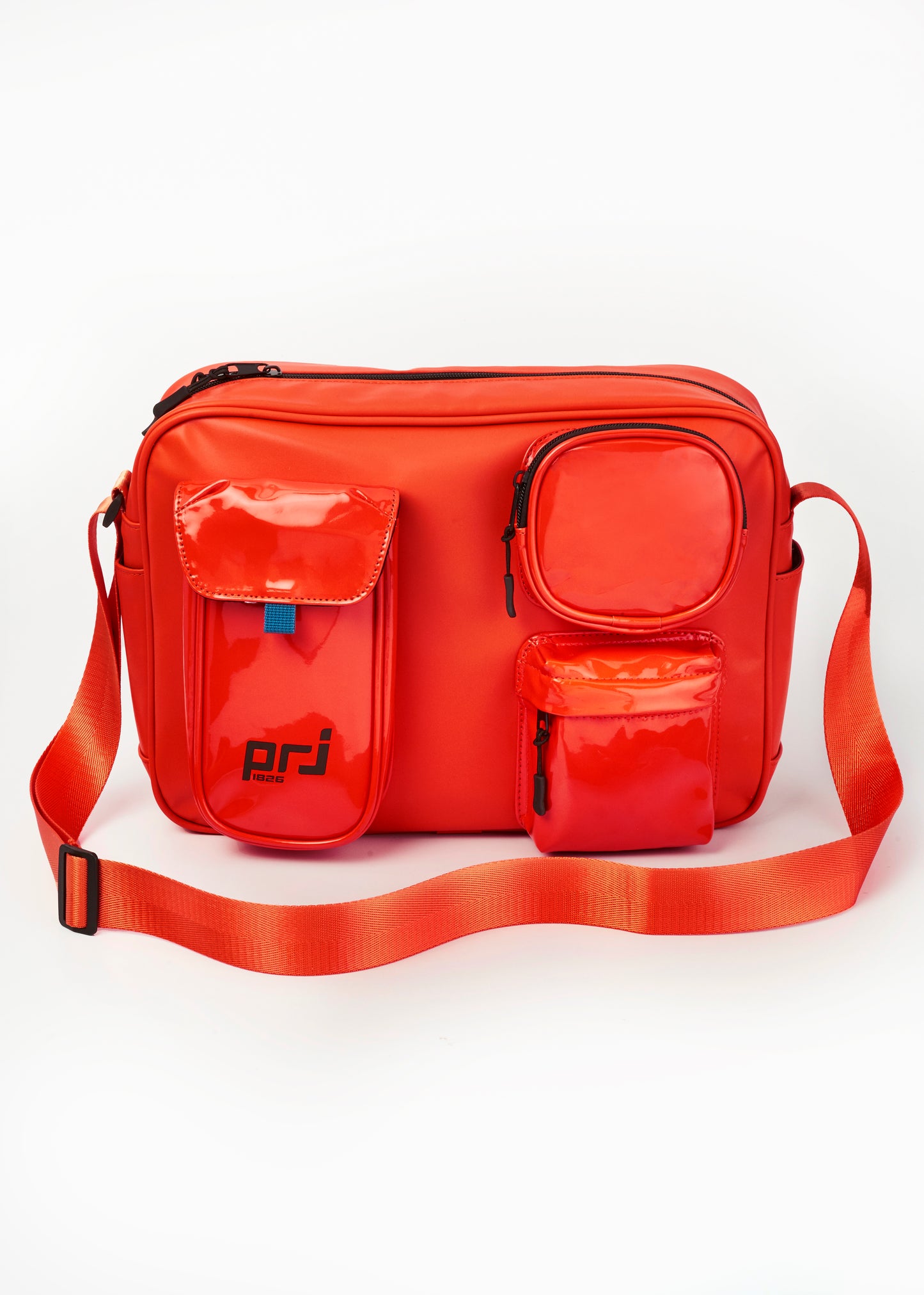 COLTER MULTIPOCKET SLING BEG ORANGE