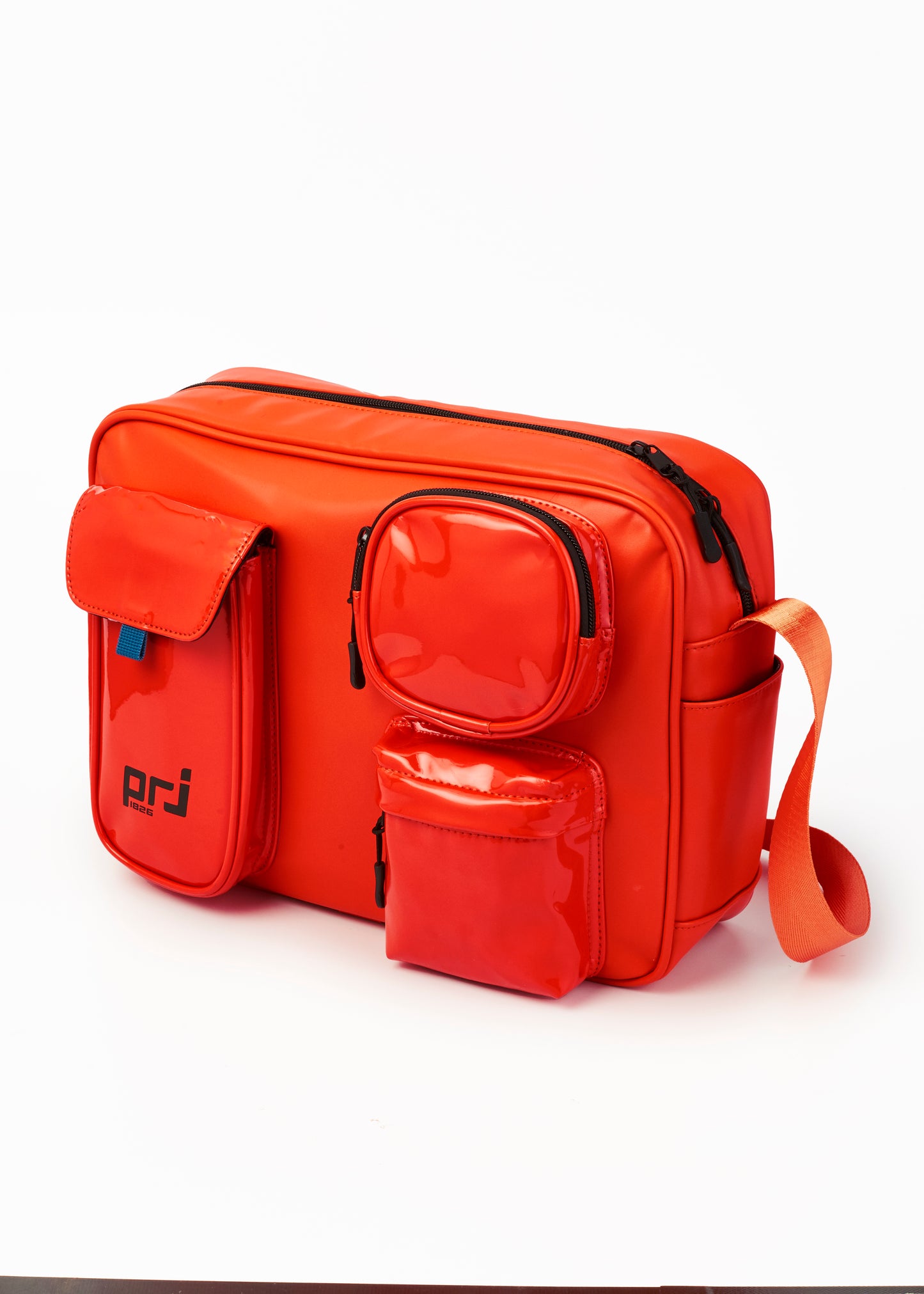 COLTER MULTIPOCKET SLING BEG ORANGE