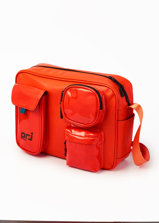 COLTER MULTIPOCKET SLING BEG ORANGE